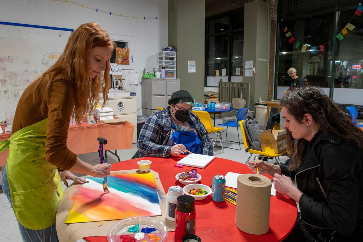 Creative Hub Executive Director Laura Marotta, left, CG Matorina and Penelope Conley all chat Thursday while making art at the Creative Hub’s Queer Artist/Maker Space in Worcester.