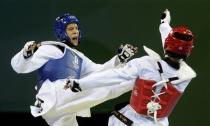 Mark Lopez (blue) of the U.S. fights Son Taejin of South Korea during the men's -68kg taekwondo gold medal competition at the Beijing 2008 Olympic Games, August 21, 2008. REUTERS/Alessandro Bianchi/File Photo