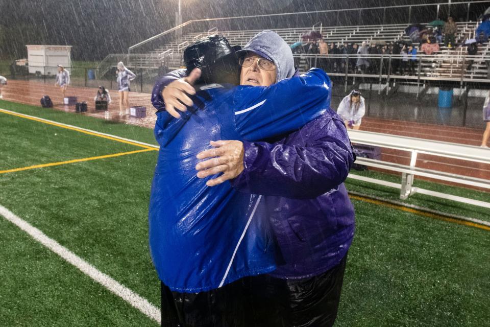 York High head coach Russ Stoner, left, hugs his friend and mentor Northern York assistant Brad Livingston following a District 3 Class 5A playoff game in 2018. The two coached a War of the Roses all-star game on Thanksgiving when Stoner was an assistant on Livingston's Central York staff in 2004.