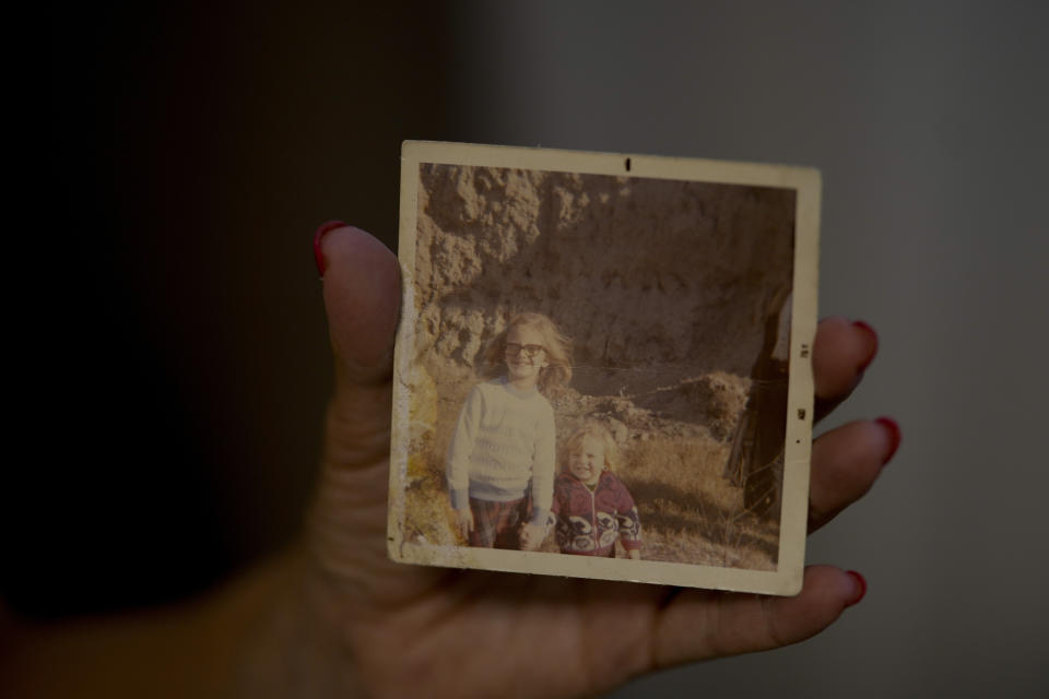 Marina Degtiar shows a picture of herself and her brother Cristian at her home in Buenos Aires, Argentina, Friday, Feb. 23, 2024. A bomb-laden van exploded inside the AMIA Jewish community center where her 21-year-old brother Cristian used to work, the worst bombing attack on civilians in Argentina's history, killed 85 - Degtiar's brother among them. (AP Photo/Natacha Pisarenko)