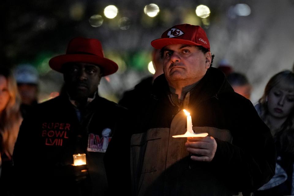 A man holds a candle at the Kansas City, Missouri vigil (AP)