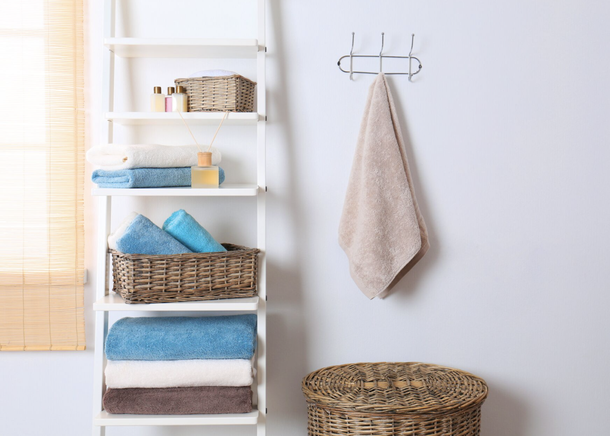 bathroom shelf ideas a simple white shelving unit with toiletries and towels