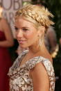 <p>Fashion-forward Sienna Miller crowns her look with a headband-esque braid.</p>