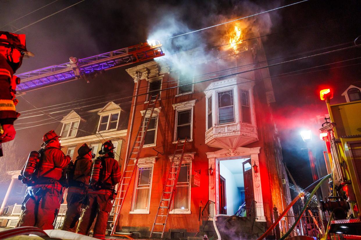 Firefighters battle a fatal second-alarm apartment building fire on the first block of West Middle Street, early Tuesday, March 12, 2024, in Gettysburg Borough.