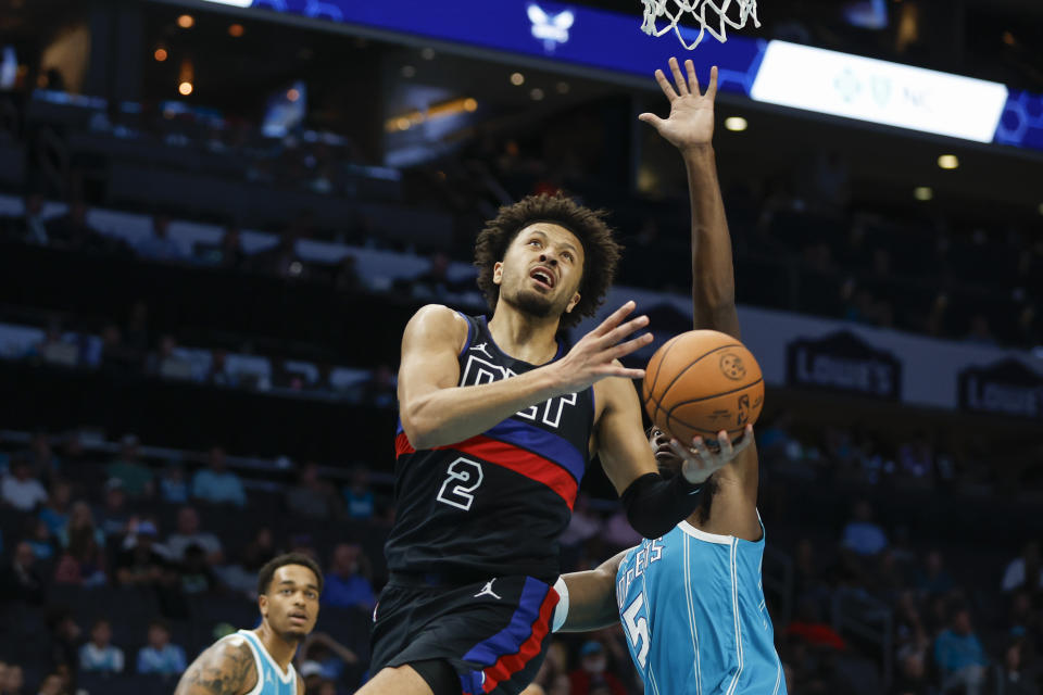 Detroit Pistons guard Cade Cunningham (2) drives to the basket ahead of Charlotte Hornets center Mark Williams, right, during the first quarter of an NBA basketball game in Charlotte, N.C., Friday, Oct. 27, 2023. (AP Photo/Nell Redmond)