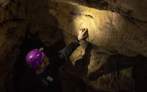 Rare protection marks were found scribed onto the cave surface - Credit: Charlotte Graham