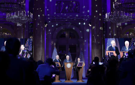 Lembit Opik, Asgardia's Head of Nation Igor Ashurbeyli and Yun Zhao attend the inauguration ceremony of Asgardia's first Head of Nation in Vienna, Austria June 25, 2018. REUTERS/Lisi Niesner