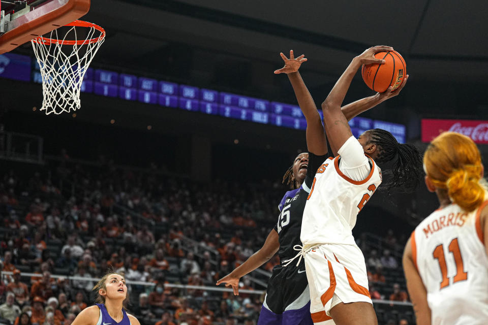 Texas forward Khadija Faye shoots over Kansas State's Heavenly Greer last Saturday. "Each person on this team, I feel has a role," Faye said. "For me, I know that coach really wants me to be on the boards and I'm good at it. Since I'm successful at it, I will just do that to help the team."