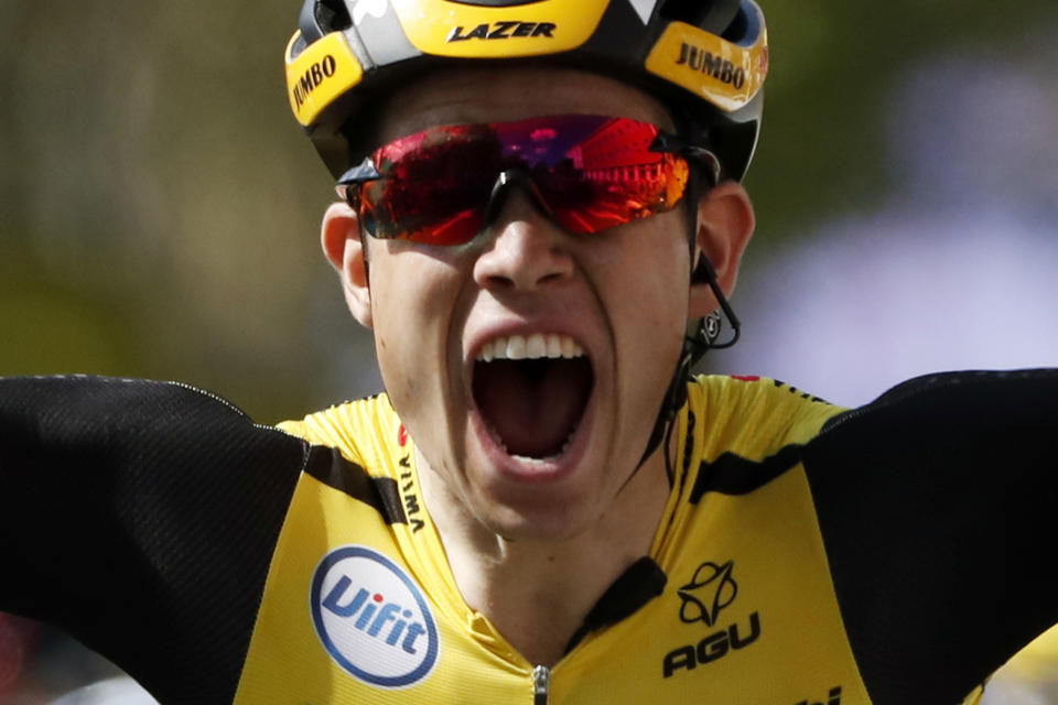 Belgium's Wout Van Aert celebrates as he crosses the finish line to win the tenth stage of the Tour de France cycling race over 217 kilometers (135 miles) with start in Saint-Flour and finish in Albi, France, Monday, July 15, 2019. (AP Photo/ Thibault Camus)