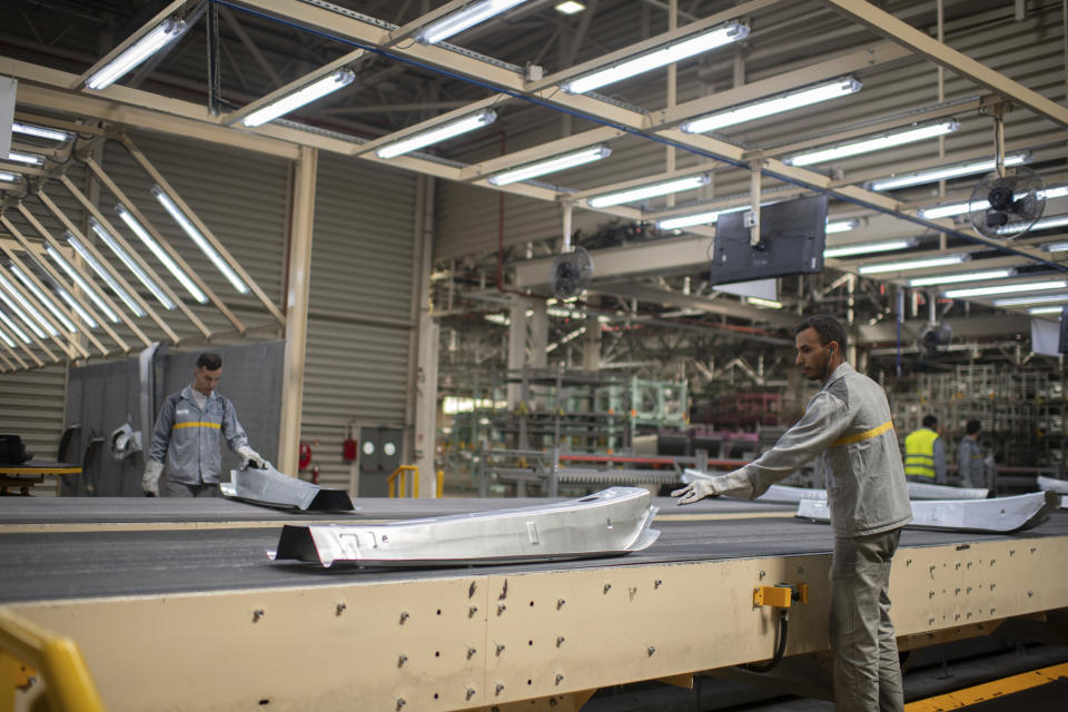 Workers assemble vehicle parts on a production line inside Renault factory, on the outskirts of Tangier, Morocco, Monday, April 29, 2024. Morocco has grown its automotive industry from virtually non-existent to Africa’s largest in less than two decades. The North African kingdom supplies more cars to Europe than China, India or Japan, and has the capacity to produce 700,000 vehicles a year. (AP Photo)