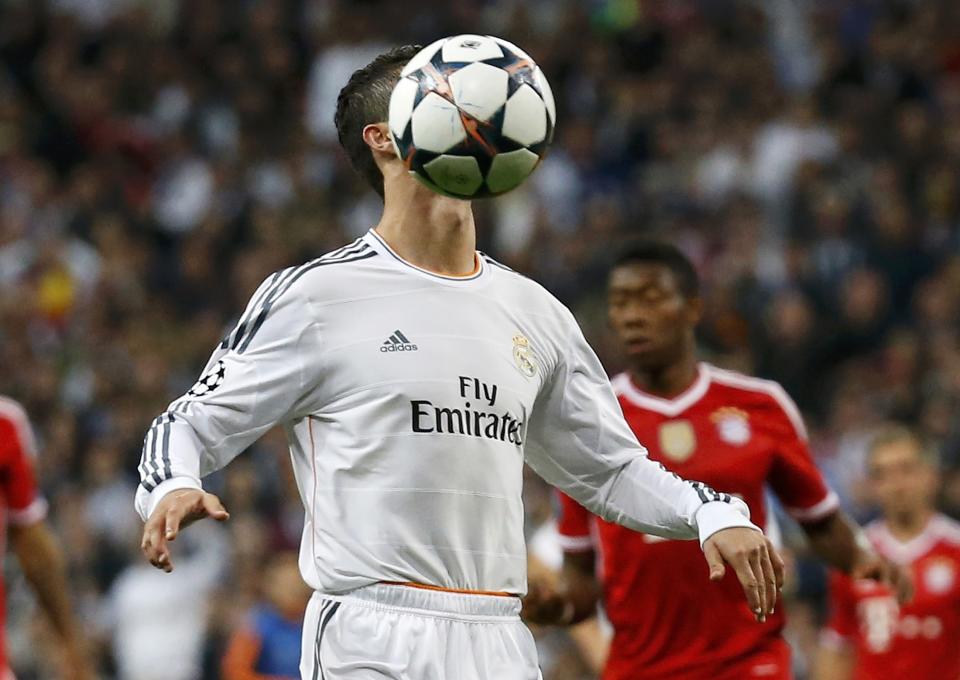 Real Madrid's Cristiano Ronaldo controls the ball during their Champions League semi-final first leg soccer match against Bayern Munich at Santiago Bernabeu stadium in Madrid