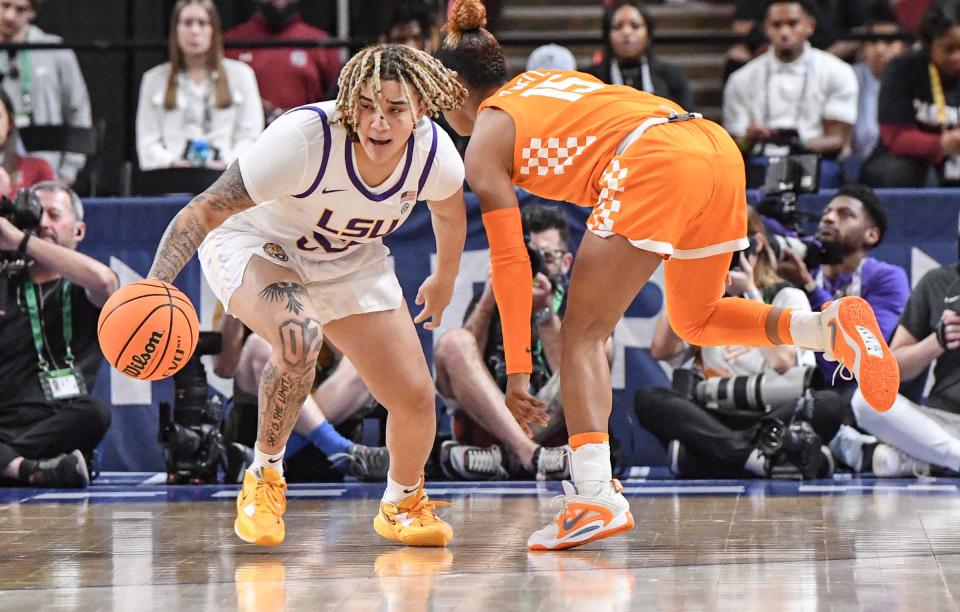 Louisiana State University guard Kateri Poole (55) takes a ball away from Tennessee guard Jasmine Powell (15) during the first quarter of the SEC Women's Basketball Tournament at Bon Secours Wellness Arena in Greenville, S.C. Saturday, March 4, 2023. 