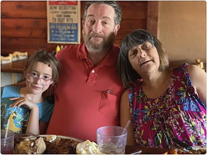 In this UGC undated photo provided by Stephanie Melendez, is her father David Johnson, center, her daughter, Kaitlyn-Rose Melendez, left, and Stephanie's mother Kathy Johnson. The Johnson family credits him with saving granddaughter Kaitlyn Rose, 9, and his wife, Kathy, by pushing them to the ground at a checkout counter at the Wal-Mart in El Paso, Texas. (Stephanie Melendez via AP)