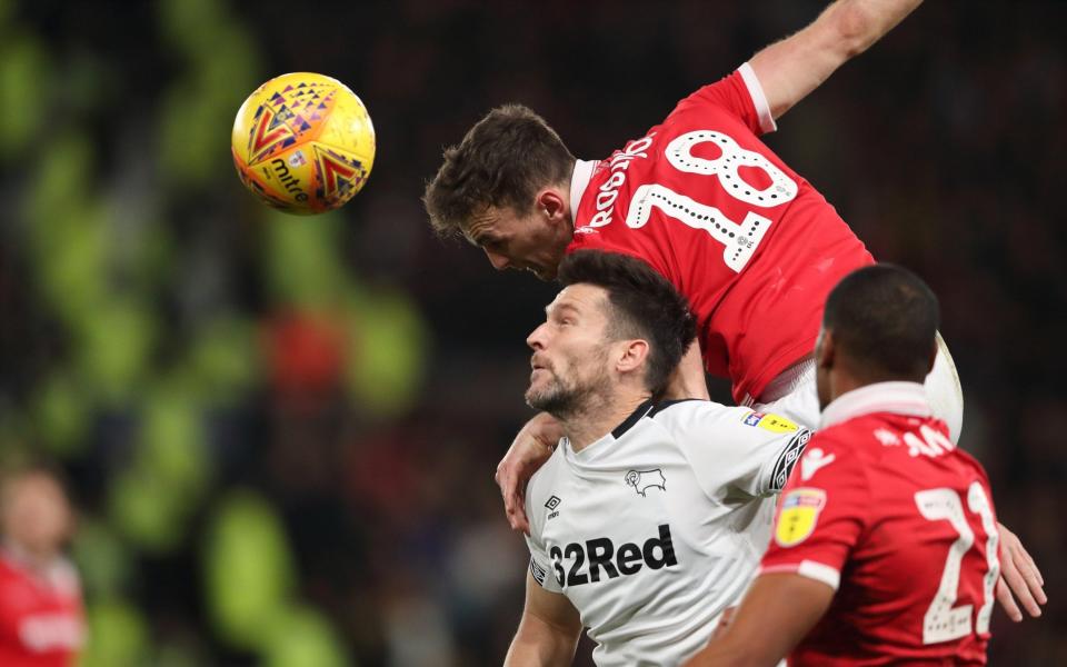 Jack Robinson climbs over David Nugent to head the ball - Getty Images Europe