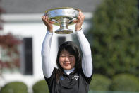 Tsubasa Kajitani, of Japan, holds up the trophy after winning the Augusta National Women's Amateur golf tournament at Augusta National Golf Club, Saturday, April 3, 2021, in Augusta, Ga. (AP Photo/David J. Phillip)