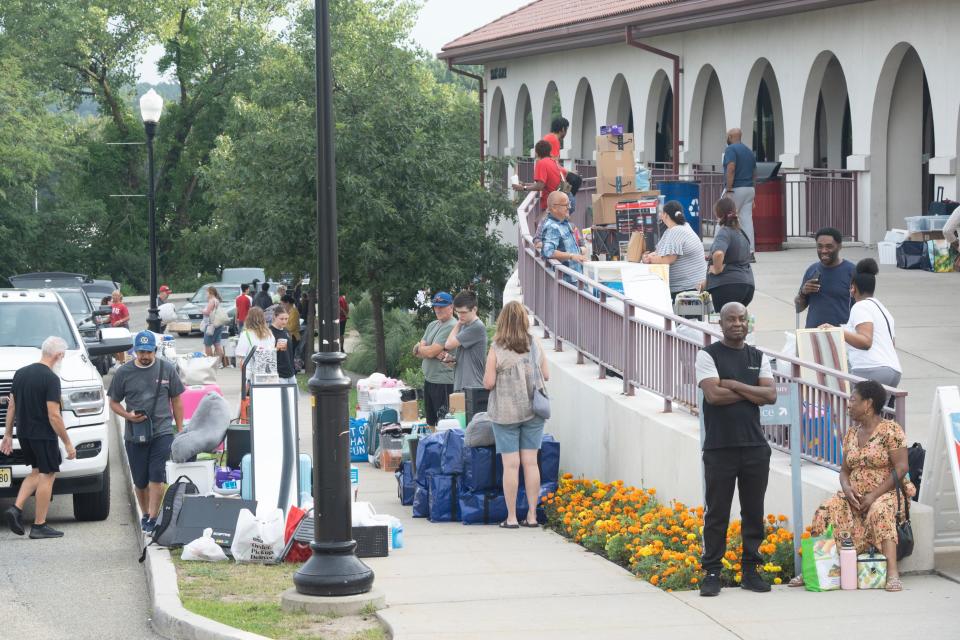 Montclair State Univeristy students move into Machuga Heights residence hall in Montclair, NJ on Monday Aug. 21, 2023. Family members help their incoming students unpack their vehicles and haul their belongings into their rooms.