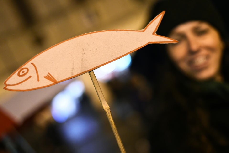 A fish symbol is displayed during a demonstration held by "the sardines", a grassroots movement against far-right League leader Matteo Salvini, in Reggio Emilia in the northern region of Emilia-Romagna, Italy, November 23, 2019. REUTERS/Guglielmo Mangiapane