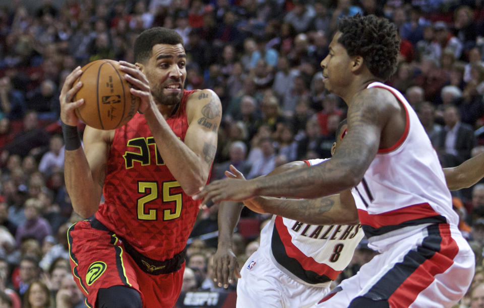 FILE - In this Jan. 20, 2016 file photo, Atlanta Hawks forward Thabo Sefolosha, left, drives on Portland Trail Blazers center Ed Davis during the first half of an NBA basketball game in Portland, Ore. On Thursday, April 6, 2017, New York City settled a wrongful arrest lawsuit for $4 million that Sefolosha filed against the city after police officers broke his leg while arresting him outside a Manhattan nightclub in 2015. That amount is more than the city has paid out in some of its most notorious police brutality cases. (AP Photo/Craig Mitchelldyer, File)