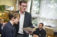 Candidate of most of the oppositional parties for the mayor of Budapest Gergely Karacsony is accompanied by his son, name not given, as he prepares to vote at the nationwide local elections in Budapest, Hungary, Sunday, Oct. 13, 2019. (Zoltan Balogh/MTI via AP)