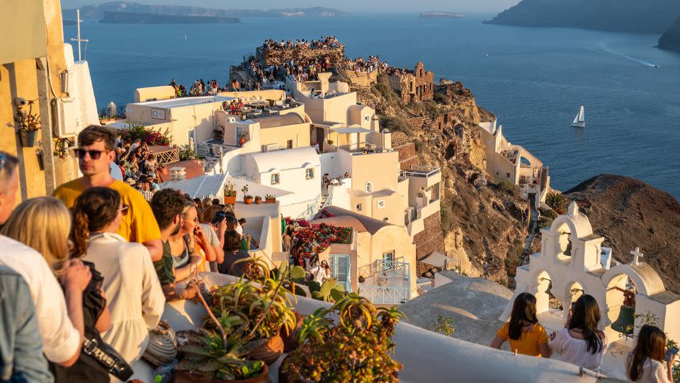 Oia, a village in the far northwest of Santorini, is the most famous place to watch the sunset.  - Xavier Duvot/Hans Lucas/AFP/Getty Images