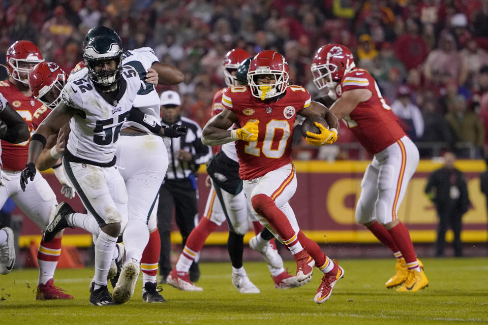 Kansas City Chiefs running back Isiah Pacheco (10) runs with the ball past Philadelphia Eagles linebacker Zach Cunningham (52) during the first half of an NFL football game, Monday, Nov. 20, 2023, in Kansas City, Mo. (AP Photo/Ed Zurga)