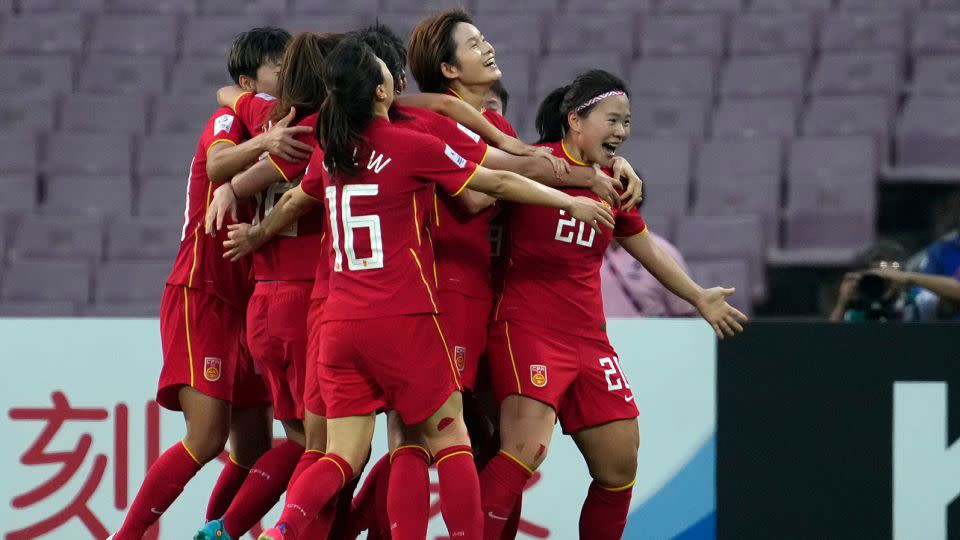 China's Xiao Yuyi, right celebrates after scoring a goal during the 2022 AFC final between China and South Korea in Mumbai, India.  - Rajanish Kakade/AP/File