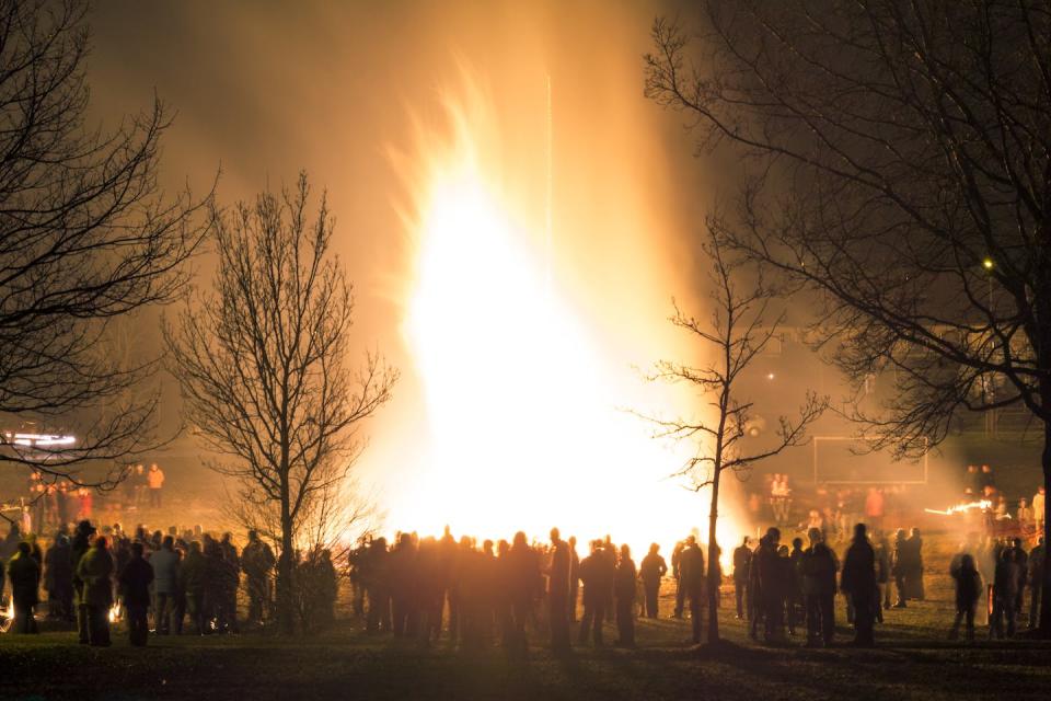 Bonfires can be built at Yule in the clearing of the woods. <a href="https://www.gettyimages.com/detail/photo/people-celebration-around-big-huge-traditional-fire-royalty-free-image/922771128?phrase=winter+solstice+fire&adppopup=true" rel="nofollow noopener" target="_blank" data-ylk="slk:Drepicter/iStock via Getty images plus;elm:context_link;itc:0;sec:content-canvas" class="link ">Drepicter/iStock via Getty images plus</a>
