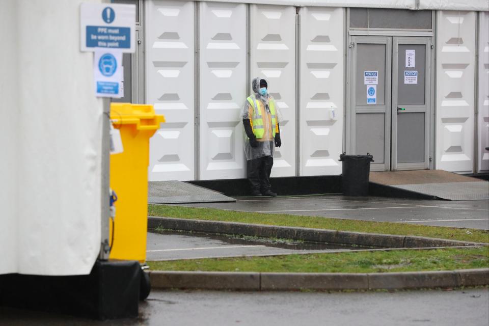 Security staff at the overflow mortuary at Breakspear Crematorium in Ruislip, London (PA)