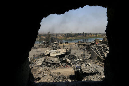 An old bridge destroyed by clashes is seen in the Old City of Mosul, Iraq July 10, 2017. REUTERS/Thaier Al-Sudani