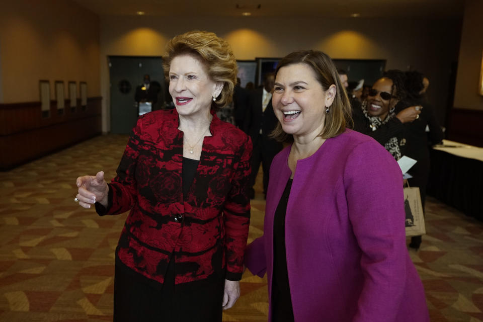FILE - Sen. Debbie Stabenow, D-Mich., left, talks with Rep. Elissa Slotkin, Monday, Jan. 16, 2023, in Lansing, Mich. Slotkin will seek an open U.S. Senate seat being vacated by Stabenow in 2024, becoming the first high-profile candidate to jump into the battleground state race. (AP Photo/Carlos Osorio, File)