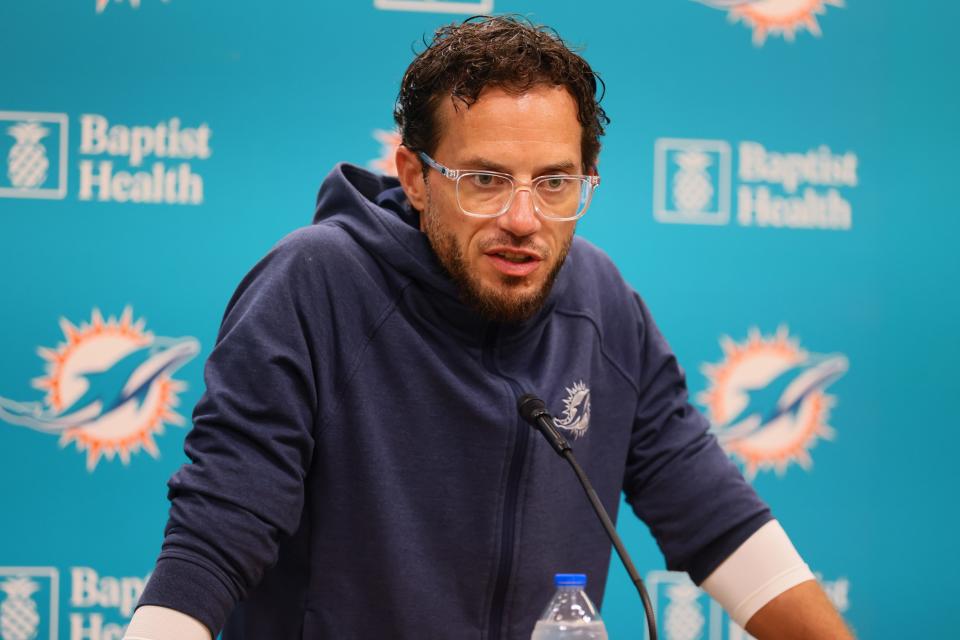 Aug 15, 2024; Miami Gardens, FL, USA; Miami Dolphins head coach Mike McDaniel talks to reporters before joint practice with the Washington Commanders at Baptist Health Training Complex. Mandatory Credit: Sam Navarro-USA TODAY Sports