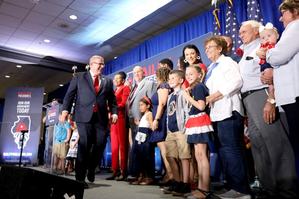 Republican gubernatorial nominee Darren Bailey on stage with his Lieutenant Governor Stephanie Trussell and their families after winning the 2022 primary election.