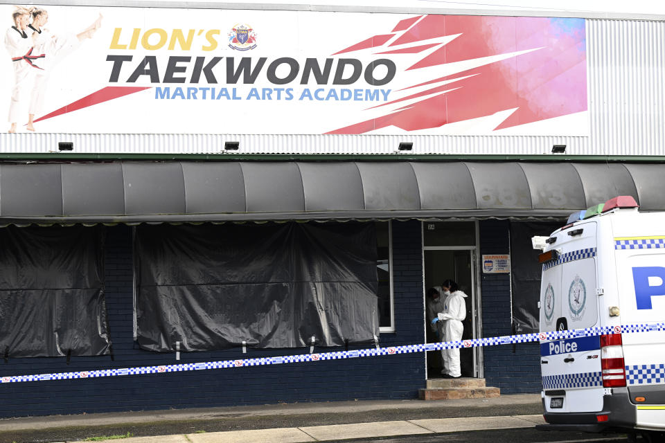 Police investigate at a crime scene in Sydney, Wednesday, Feb. 21, 2024. A taekwondo instructor killed a 7-year-old student at his academy and the boy's parents before going to a Sydney hospital with stab and slash wounds on his body, police said Wednesday. (Dan Himbrechts/AAP Image via AP)