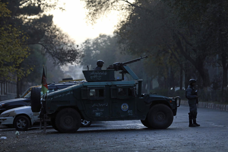 Afghan police patrol at the site of an attack at Kabul University in Kabul, Afghanistan, Monday, Nov. 2, 2020. The brazen attack by gunmen who stormed the Kabul University has left many dead and wounded in the Afghan capital. The assault sparked a hours-long gunbattle. (AP Photo/Rahmat Gul)