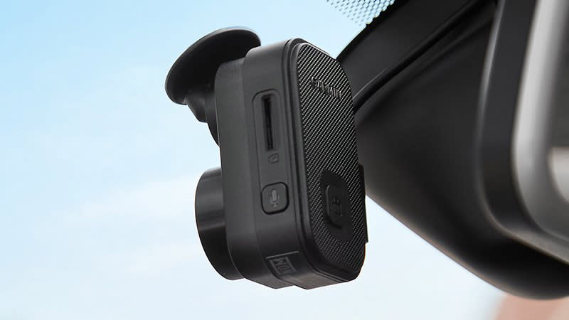  The Garmin Dash Cam Mini 2 mounted inside a windscreen. 