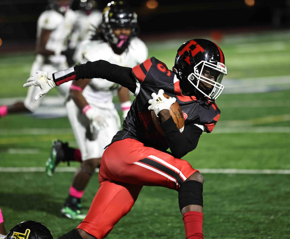 Hughes wide receiver Elijah Engleman (15) runs the ball during a football game with Taft Friday, Oct. 14, 2022.