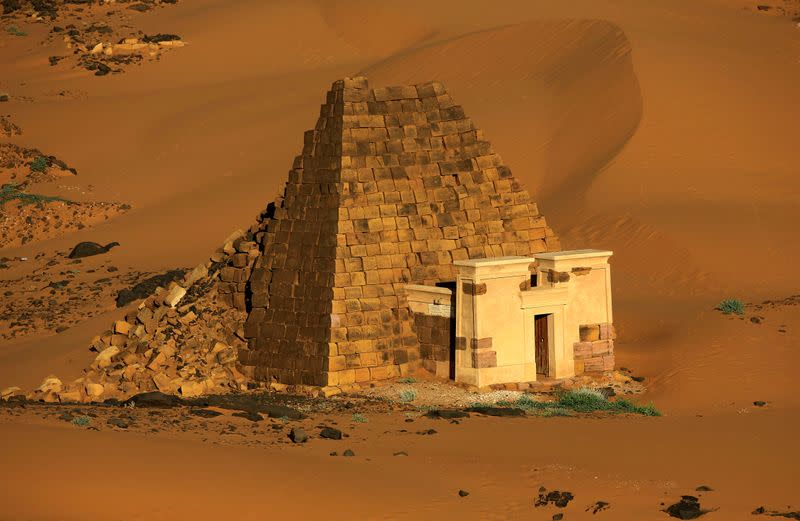 FILE PHOTO: Creeping desert sands surround the Royal Cemeteries of Meroe Pyramids in Begrawiya at River Nile State