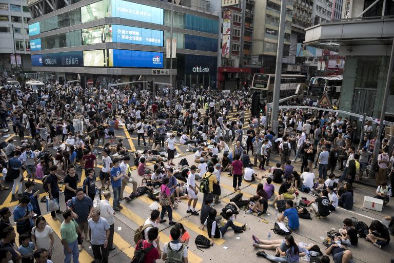 Pro-democracy protesters block off Nathan Road at the heart of the Kowloon district of Hong Kong