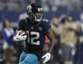 Jacksonville Jaguars wide receiver Dede Westbrook (12) takes a Blake Bortles pass into the end zone for a touchdown in the second half of an NFL football game against the Dallas Cowboys in Arlington, Texas, Sunday, Oct. 14, 2018. (AP Photo/Jim Cowsert)