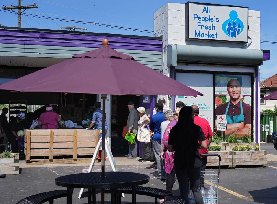 Customers line up outside All People's Fresh Market on June 8. The South Side market provides free, fresh produce to households earning less than 200% of the federal poverty guidelines.