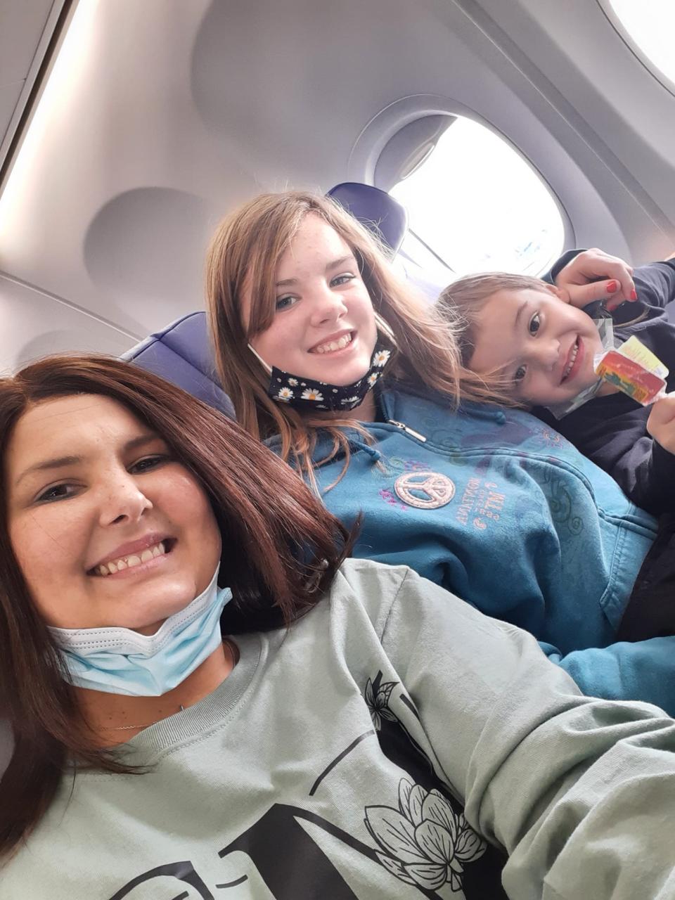 Stephanie Lee with her kids on their first flight.