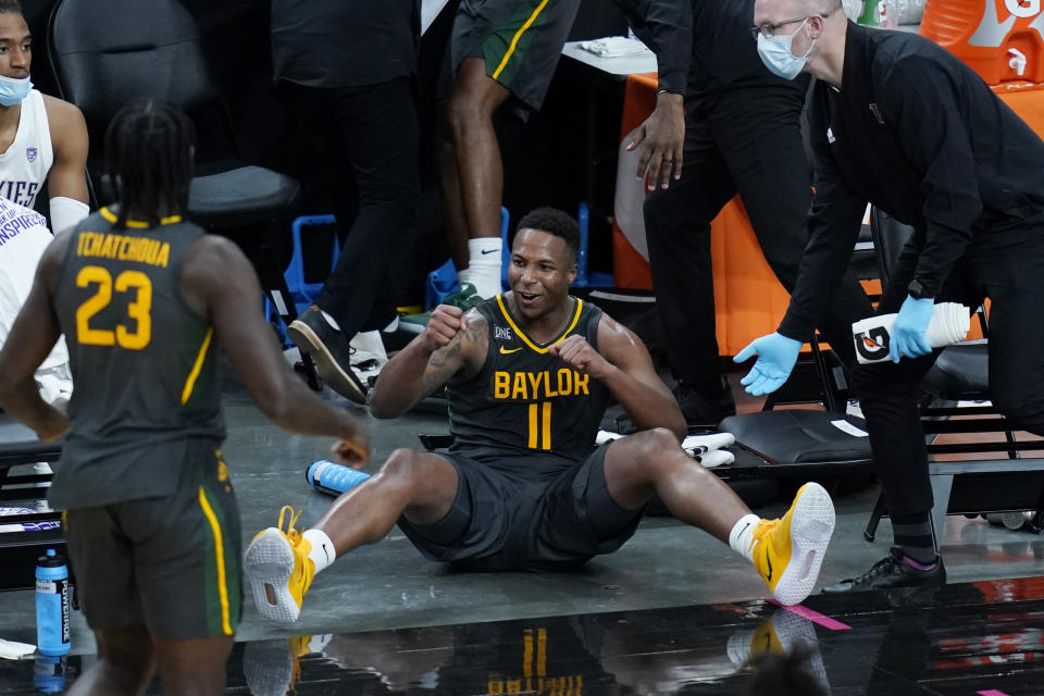 Baylor's Mark Vital (11) celebrates after a play against Washington during the second half of an NCAA college basketball game Sunday, Nov. 29, 2020, in Las Vegas. (AP Photo/John Locher)