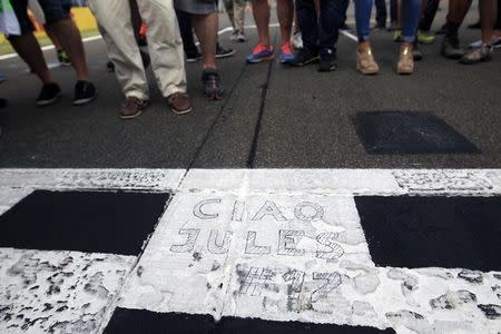 A tribute for the late French Formula One driver Jules Bianchi is seen at the drivers parade before the Hungarian F1 Grand Prix at the Hungaroring circuit, near Budapest, Hungary July 26, 2015. REUTERS/Bernadett Szabo