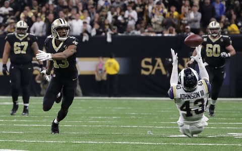 Los Angeles Rams strong safety John Johnson (43) intercepts a tipped pass against New Orleans Saints wide receiver Michael Thomas (13) during overtime in the NFC Championship game at Mercedes-Benz Superdome - Credit: USA TODAY