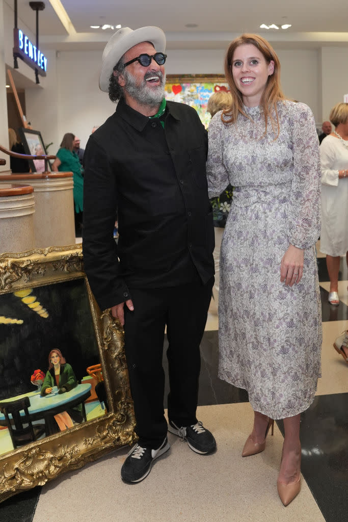 Mr Brainwash and Princess Beatrice in Kurt Geiger leather shoes, pumps, neutral shoe, leather heels, pointed toe shoe, attend the unveiling of street artist Mr Brainwash's work at Jack Barclay Bentley in central London. 