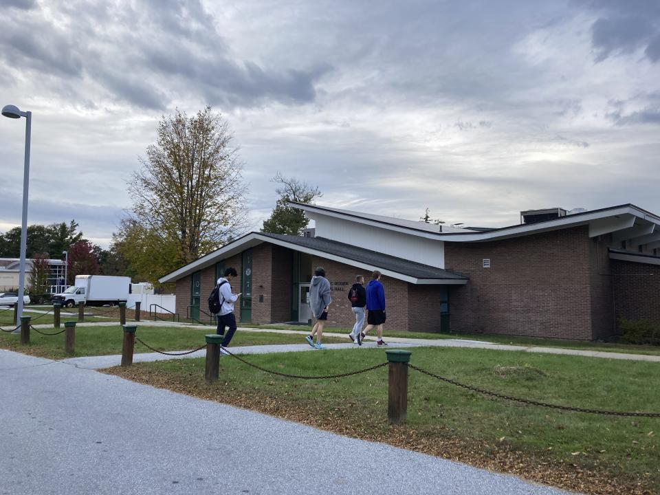 Students walk around the Vermont State University Castleton Campus on Tuesday, Oct. 10, 2023 in Castleton, Vt.. Police were searching for a suspect who shot and killed a retired dean on a nearby rail trail last week. (AP Photo/Lisa Rathke)