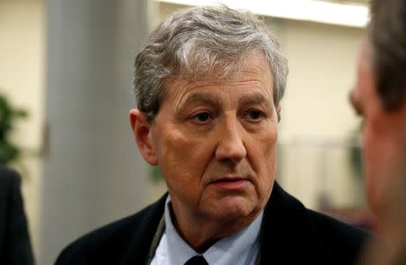 FILE PHOTO - U.S. Senator John Kennedy (R-LA) speaks to reporters as he arrives for a nomination vote at the U.S. Capitol in Washington, U.S., December 18, 2017. REUTERS/Joshua Roberts