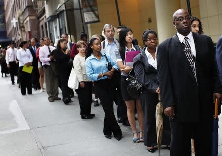 People wait in line to enter a job fair in New York August 15, 2011. REUTERS/Shannon Stapleton