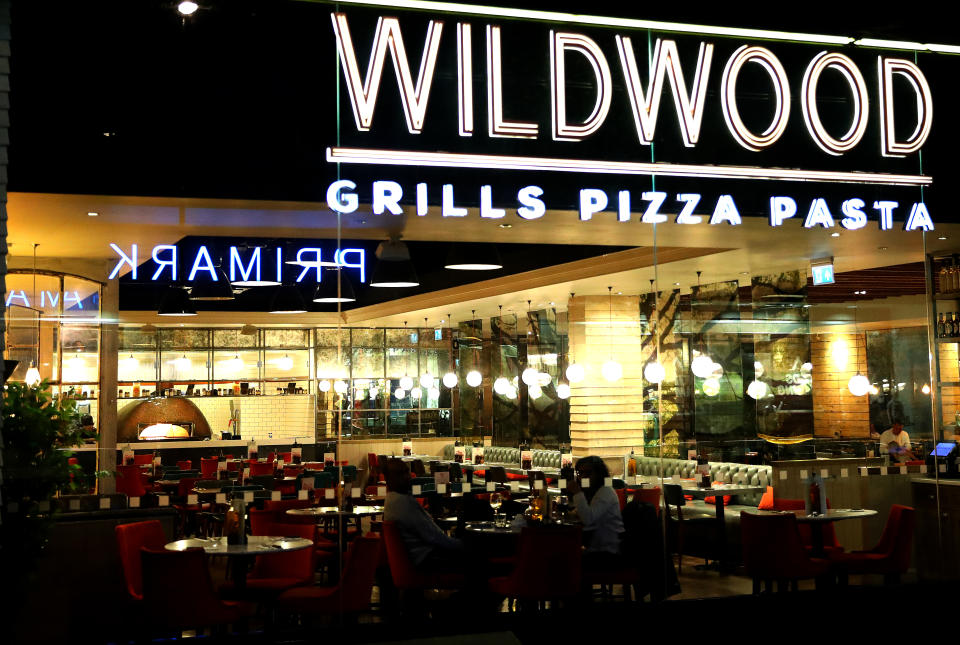 CAMBERLEY, UNITED KINGDOM,  - MARCH 20:  A couple enjoy a quiet dinner at Wildwood Restaurant  on March 20, 2020 in Camberley, United Kingdom. British Prime Minister Boris Johnson announced that the country's bars, pubs, restaurants and cafes must close tonight to curb the spread of COVID-19, which has killed more than 100 people in the UK. (Photo by Warren Little/Getty Images)