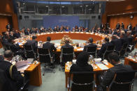 German Chancellor Angela Merkel, rear center, leads a conference on Libya at the chancellery in Berlin, Germany, Sunday, Jan. 19, 2020. (Hannibal Hanschke/Pool Photo via AP)